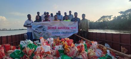 Giving relief to Sylhet flood victims on behalf of Bangladesh Computer Society.